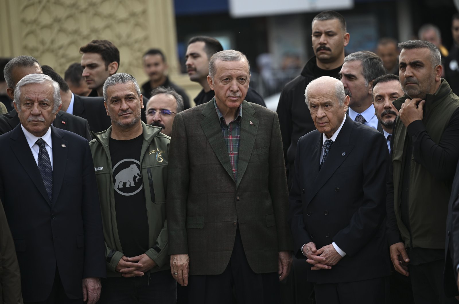 President Recep Tayyip Erdoğan (C) and Nationalist Movement Party (MHP) Chairperson Devlet Bahçeli (2nd R) attend a ceremony to start the construction of houses and hospitals in the earthquake-hit Iskenderun, Hatay, southern Türkiye, March 24, 2023. 