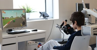 A child with spinal cord damage, rescued from the earthquake debris, is being treated in the Robotic Rehabilitation Center in Ankara, Türkiye, March 27, 2023. (AA Photo)
