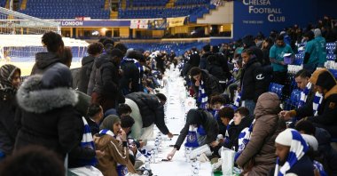 People have their iftar (breaking fast) meal pitch side at Stamford Bridge stadium, the ground of Chelsea Football Club, during Ramadan, London, U.K., March 26, 2023. (Reuters Photo)