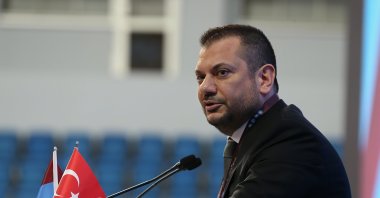 Newly-elected Trabzonspor's Chair Ertuğrul Doğan speaks to delegates at the general assembly held at the Hayri Gür Sports Hall, Trabzon, Türkiye, March 26, 2023. (AA Photo)