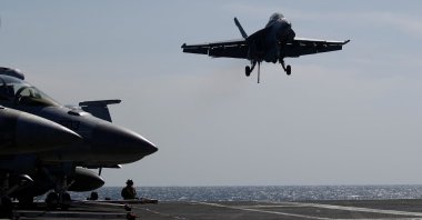 A U.S. Navy F-18 Super Hornet lands on the flight deck of the USS Nimitz, off the coast of Busan, South Korea, March 27, 2023. (Reuters Photo)