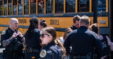 School buses with children arrive at Woodmont Baptist Church to be reunited with their families after a mass shooting at The Covenant School in Nashville, Tennessee on March 27, 2023. (AFP Photo)