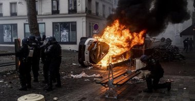 A car burns during riots by PKK supporters in Paris, France, Dec. 24, 2022. (AA Photo)