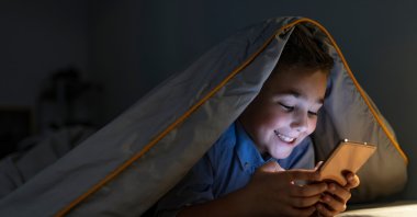 A child uses a mobile gadget. (Courtesy of Find My Kids Türkiye)