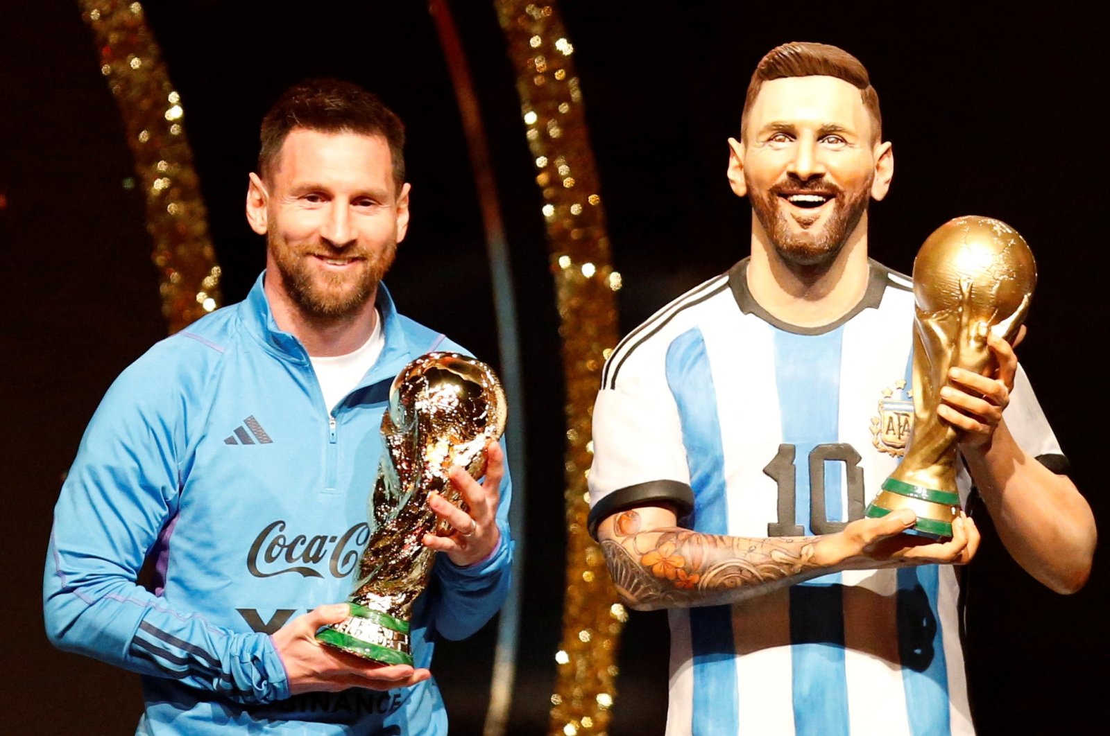 Argentina&#039;s Lionel Messi poses with a statue of himself holding the World Cup during the Conmebol event at the Conmebol headquarters, Luque, Paraguay, March 27, 2023. (Reuters Photo)