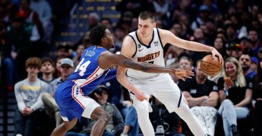 Denver Nuggets center Nikola Jokic (R) controls the ball as Philadelphia 76ers forward Paul Reed (L) guards in the third quarter at Ball Arena, Denver, Colorado, U.S., March 27, 2023. (Reuters Photo)