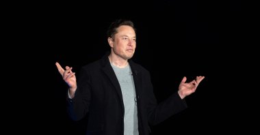 Elon Musk gestures as he speaks during a press conference at SpaceX&#039;s Starbase facility near Boca Chica Village in South Texas, U.S., Feb. 10, 2022. (AFP Photo)