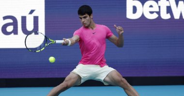 Spain's Carlos Alcaraz hits a forehand against USA's Tommy Paul on day 9 of the Miami Open at Hard Rock Stadium, Miami, US, March 28, 2022. (Reuters Photo)