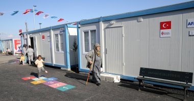 A child plays hopscotch outside a container home sheltering earthquake survivors in Kahramanmaraş, Türkiye, March 29, 2023. (AA Photo)