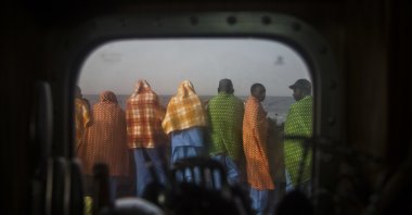 African refugees and migrants, mostly from Sudan and Senegal, look at the sea aboard Golfo Azurro, the Spanish NGO Proactiva Open Arms rescue ship, after being rescued from a boat out of control at 25 miles north of Sabratha, off the Libyan coast, Feb. 23, 2016. (AP Photo)