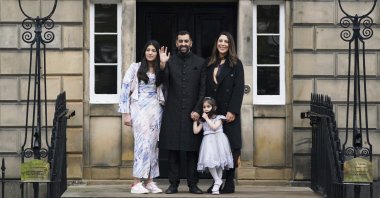 Humza Yousaf (C) with his wife Nadia el-Nakla, daughter Amal, 3, and step-daughter Maya (L) pose for a photo, at Bute House, Edinburgh, Scotland, March 29, 2023. (AP Photo)