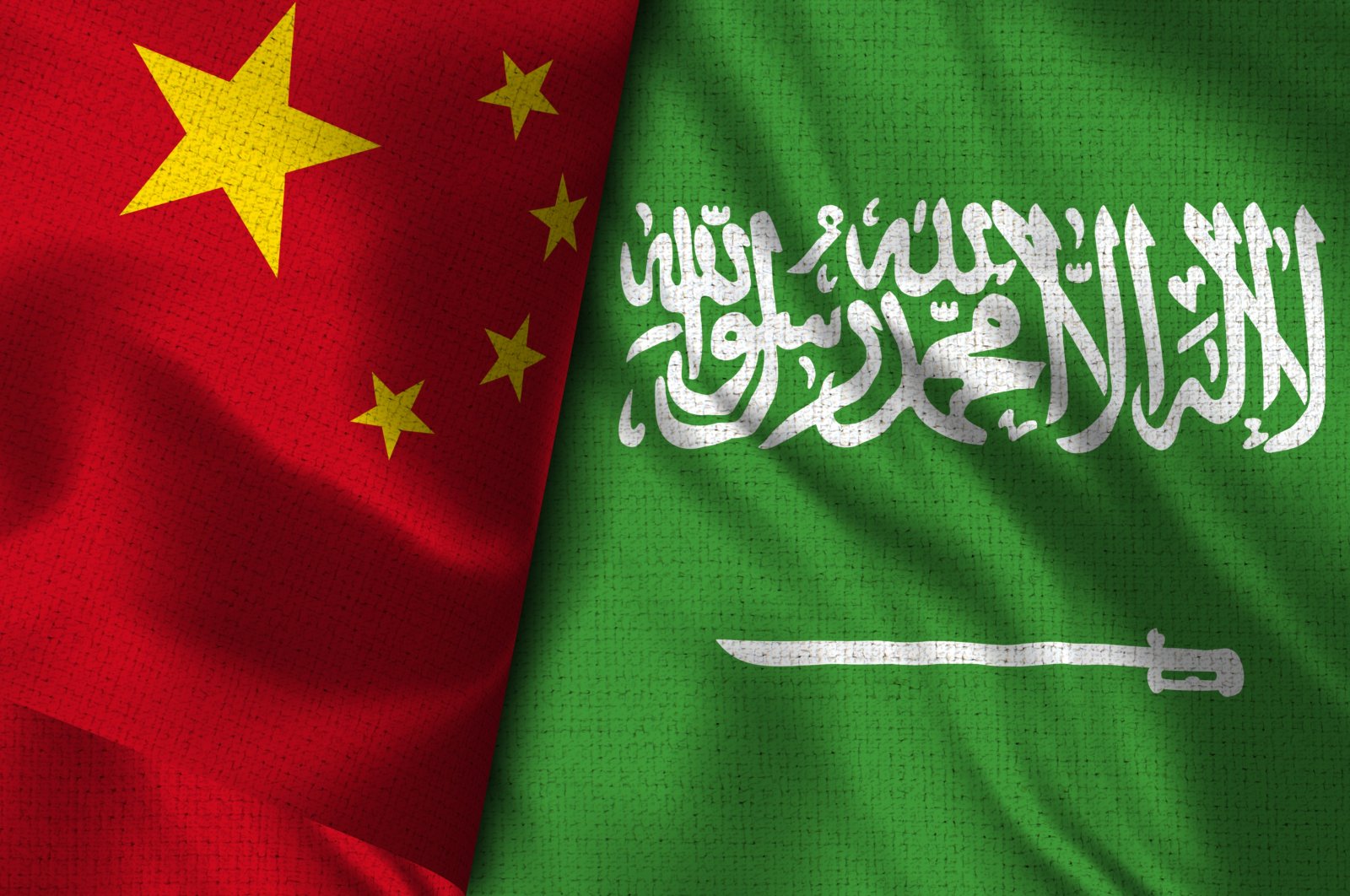 This illustration shows the flags of China (L) and Saudi Arabia.