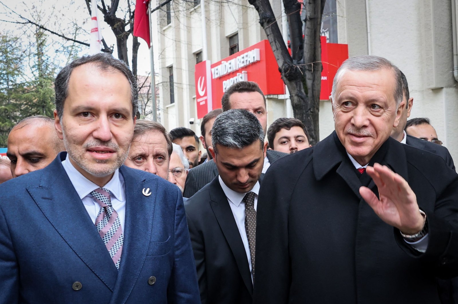 President Recep Tayyip Erdoğan (R) and leader of New Welfare Party, Fatih Erbakan (L) leave party&#039;s headquarters after a visit in Ankara, on March 28, 2023. (AFP Photo)