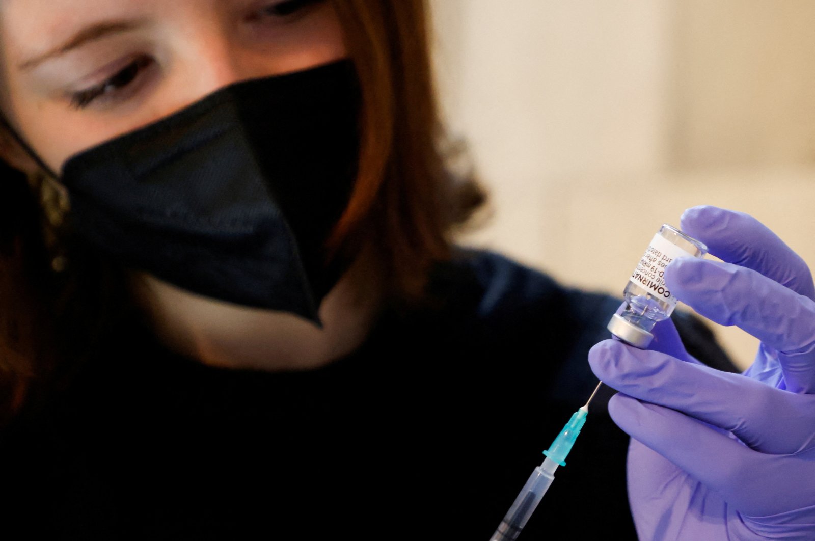 A volunteer prepares a syringe containing a dose of Pfizer-BioNTech COVID-19 vaccine, at a vaccination center in Saint Stephen&#039;s Cathedral, in Vienna, Austria, Feb. 5, 2022. (Reuters Photo)