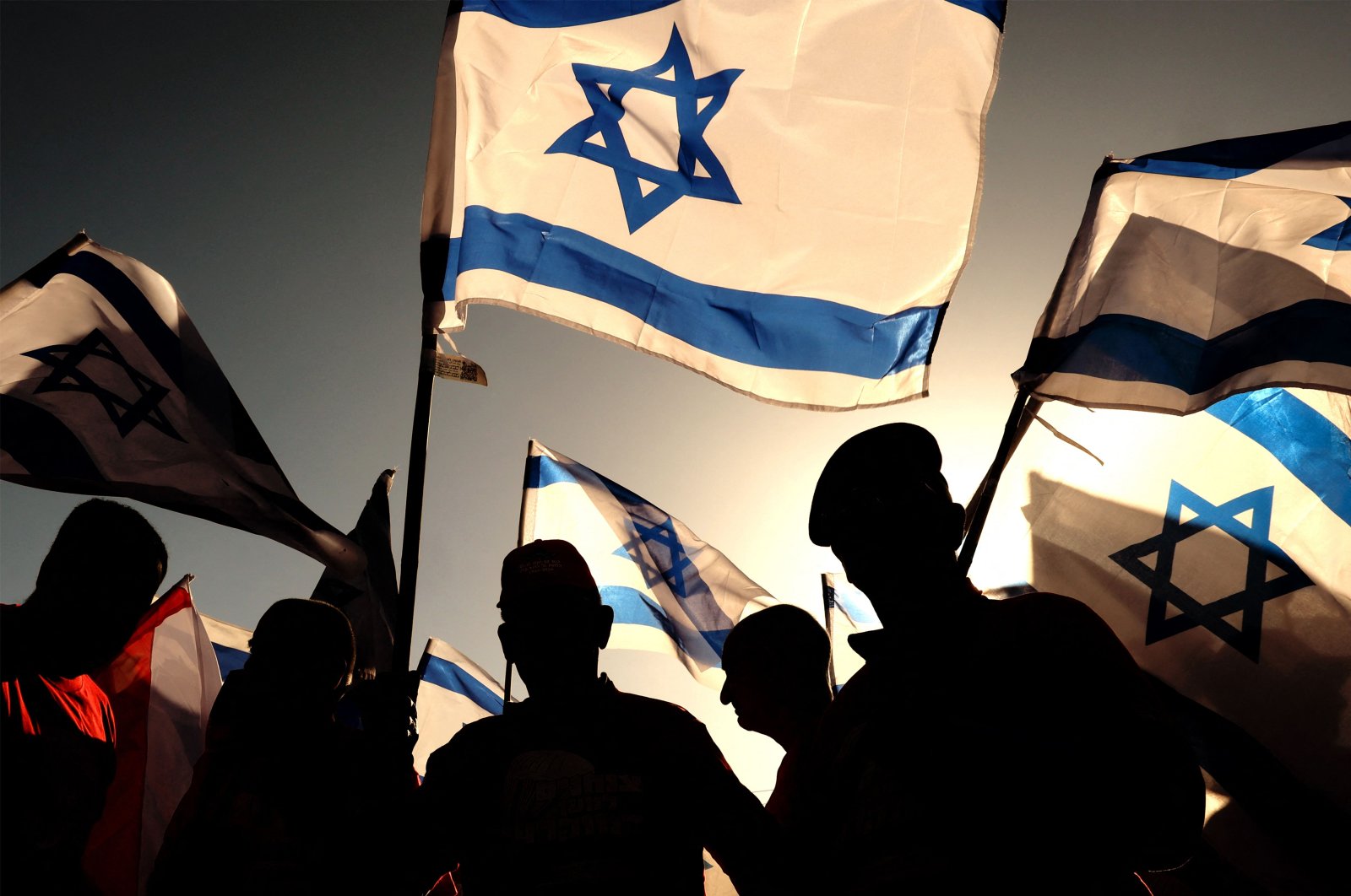Israeli military veterans wave national flags during a rally against the government&#039;s judicial reform bill, Netanya, Israel, March 28, 2023. (AFP Photo)
