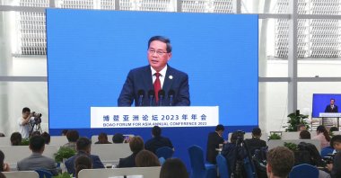 Journalists watch a screen showing China's Premier Li Qiang delivering a speech during the opening of the Boao Forum for Asia in Boao, Hainan province, China, March 30, 2023. (AFP Photo)