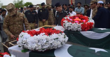 Police officials attend the funeral of fellow officers killed in an improvised explosive device (IED) blast in Lakki Marwat, Pakistan, March 30, 2023. (EPA Photo)