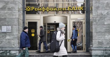 People walk in front of Raiffeisen bank in Moscow, Russia, March 16, 2023. (EPA Photo)
