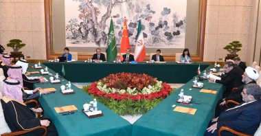 Wang Yi, a member of the Political Bureau of the Communist Party of China (CPC) Central Committee and director of the Office of the Foreign Affairs Commission of the CPC Central Committee, presides over the closing meeting of the talks between a Saudi delegation and an Iranian delegation in Beijing, China, March 10, 2023. (AP Photo)