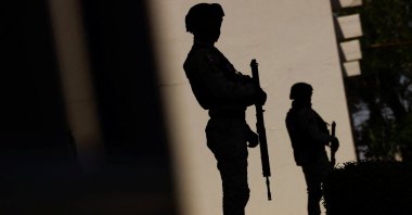 Members of the Mexican National Guard stand guard outside a hospital where injured migrants are being treated, after a fire broke out late on Monday at a migrant holding center, in Ciudad Juarez, Mexico, March 29, 2023. (Reuters Photo)