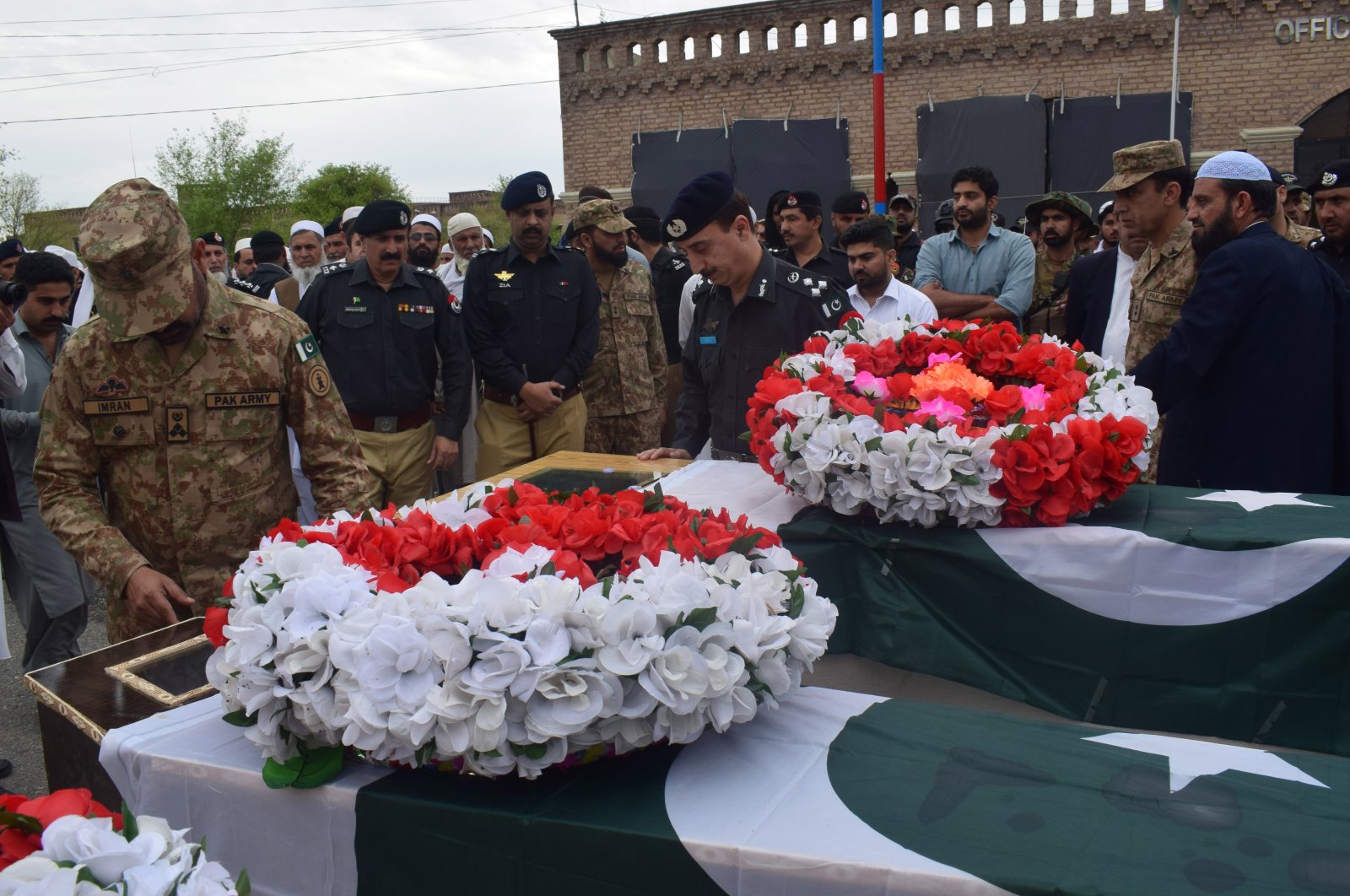 Police officials attend the funeral of fellow officers killed in an improvised explosive device (IED) blast in Lakki Marwat, Pakistan, March 30, 2023. (EPA Photo)