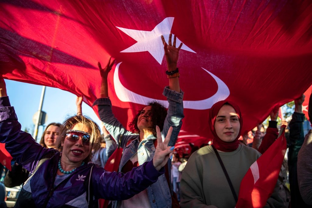 Women carry a Turkish flag during the youth march organized by the Directorate of Youth and Sports in Istanbul, Türkiye, May 19, 2022. (Getty Images)