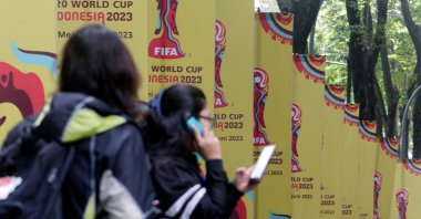 Workers stand in front of U-20 World Cup banners following FIFA revoking Indonesia&#039;s hosting status for the 2023 U-20 World Cup, at a sport arena, Jakarta, Indonesia, March 30, 2023. (EPA Photo)