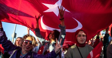 Women carry a Turkish flag during the youth march organized by the Directorate of Youth and Sports in Istanbul, Türkiye, May 19, 2022. (Getty Images)