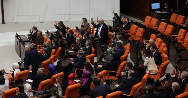 Turkish lawmakers from the ruling Justice and Development Party (AK Party) vote in favor to approve Finland&#039;s application to join NATO, with 276 votes, at the Turkish Parliament in the capital Ankara, Türkiye, March 30, 2023. (AFP Photo)