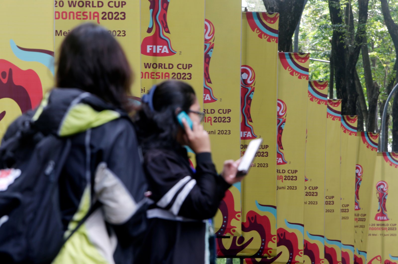 Workers stand in front of U-20 World Cup banners following FIFA revoking Indonesia&#039;s hosting status for the 2023 U-20 World Cup, at a sport arena, Jakarta, Indonesia, March 30, 2023. (EPA Photo)