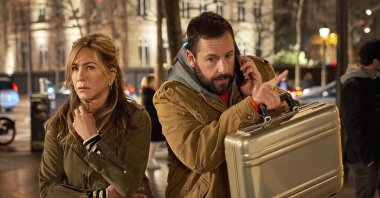 This image released by Netflix shows Jennifer Aniston (L) and Adam Sandler in a scene from the film &quot;Murder Mystery 2.&quot; (AP Photo)