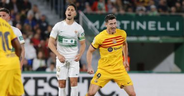 Barcelona's striker Robert Lewandowski (R) celebrates after scoring the 0-1 during the La Liga match against Elche at Martinez Valero stadium, Elche, Alicante, Spain, April 1, 2023. (EPA Photo)