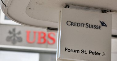 Logos of Swiss bank UBS and Credit Suisse in Zurich, Switzerland, March 20, 2023. (Reuters Photo)