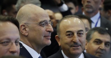 Greek Foreign Minister Nikos Dendias (2nd L) and Foreign Minister Mevlüt Çavuşoğlu (R) stand together at the opening of a donors' conference, in Brussels, Belgium, March 20, 2023. (EPA Photo)