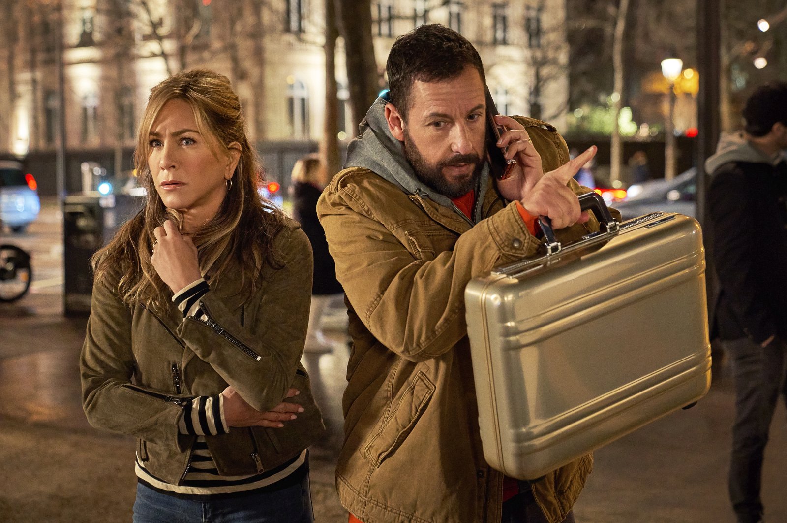 This image released by Netflix shows Jennifer Aniston (L) and Adam Sandler in a scene from the film &quot;Murder Mystery 2.&quot; (AP Photo)