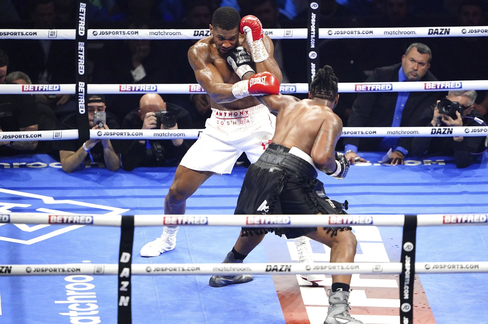 Jermaine Franklin, right, strikes Anthony Joshua during a heavyweight boxing match at The O2, London, UK., April 1, 2023. (AP Photo)