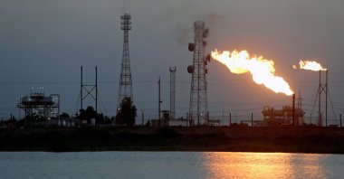 Flames emerge from flare stacks at Nahr Bin Umar oil field, north of Basra, Iraq, March 9, 2020. (Reuters Photo)