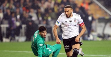 Beşiktaş's Cenk Tosun leaves Fenerbahçe keeper Altay Bayındır on the floor during the Süper Lig derby, Istanbul, Türkiye, April 2, 2023. (AA Photo)