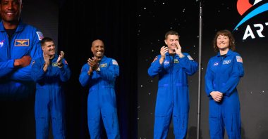 (L-R) Astronauts Jeremy Hansen, Victor Glover, Reid Wiseman and Christina Hammock Koch stand onstage after being selected for the Artemis II mission, NASA Johnson Space Center Ellington Field in Houston, Texas, U.S., April 3, 2023. (AFP Photo)