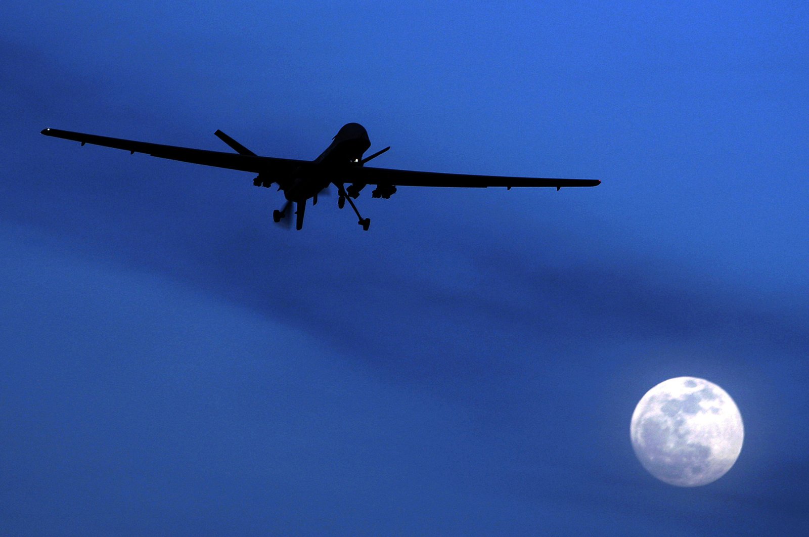 This file photo shows a U.S. Predator drone over Kandahar Air Field, southern Afghanistan, Jan. 31, 2010. (AP Photo)
