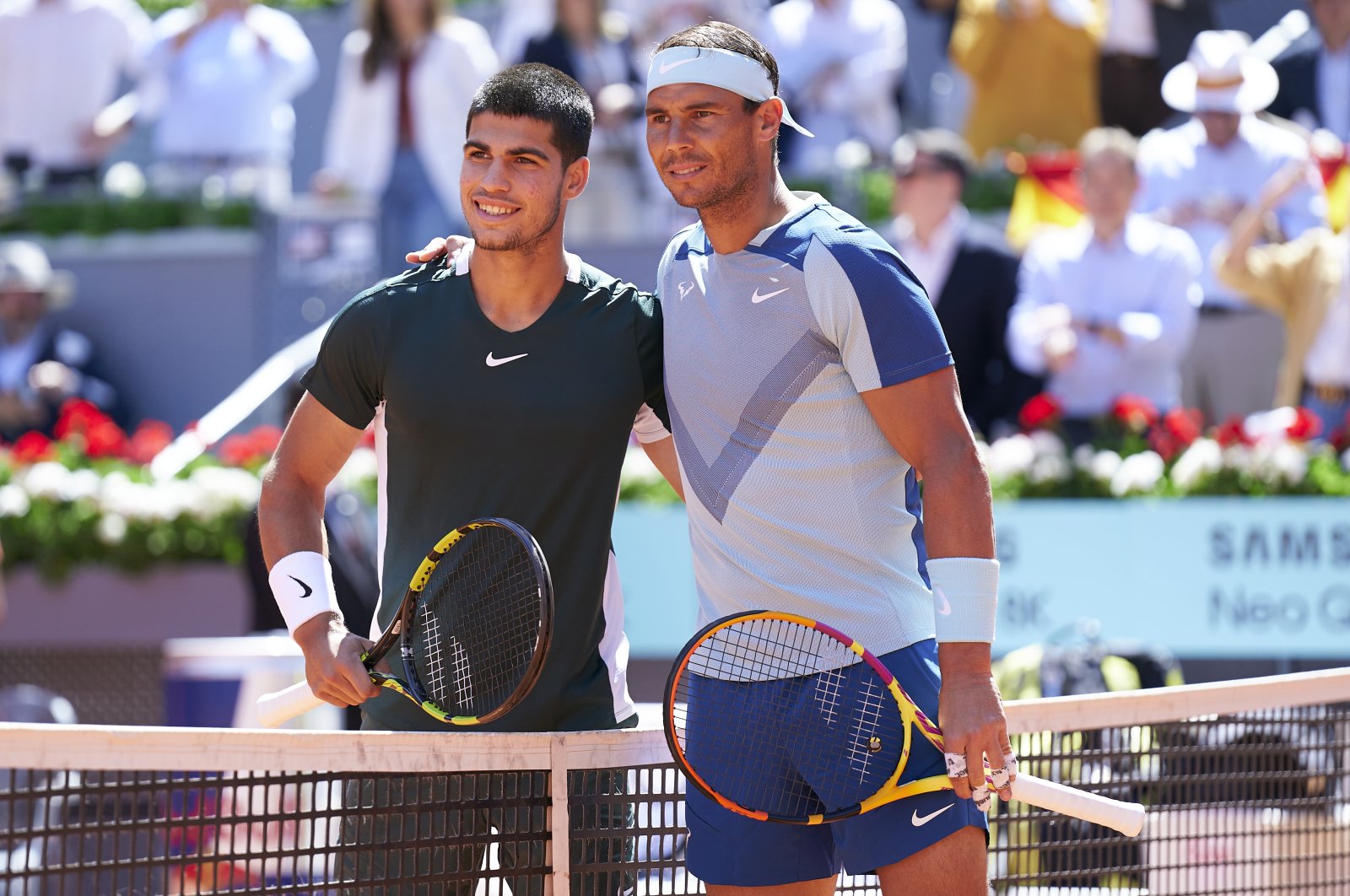 Spaniards Rafael Nadal (R) and Carlos Alcaraz (R) pose for a photograph on day 9 of Mutua Madrid Open at La Caja Magica, Madrid, Spain, May 06, 2022. (Getty Images Photo)
