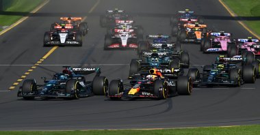 Mercedes driver George Russell of Great Britain (L) passes Red Bull driver Max Verstappen of Netherlands (2nd L) at the start of the 2023 Australian Grand Prix at the Albert Park Circuit, Melbourne, Australia, April 2, 2023. (EPA Photo)