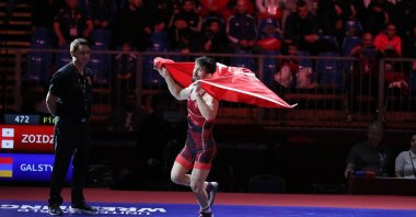 Türkiye's European wrestling champion, Kerem Kamal runs with the Turkish flag after winning, Budapest, Hungary, Nov. 2, 2019. (AA Photo)