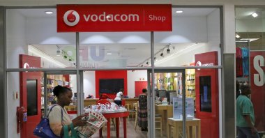 A shopper walks past a Vodacom shop in Johannesburg, South Africa, Feb. 4, 2015. (Reuters Photo)