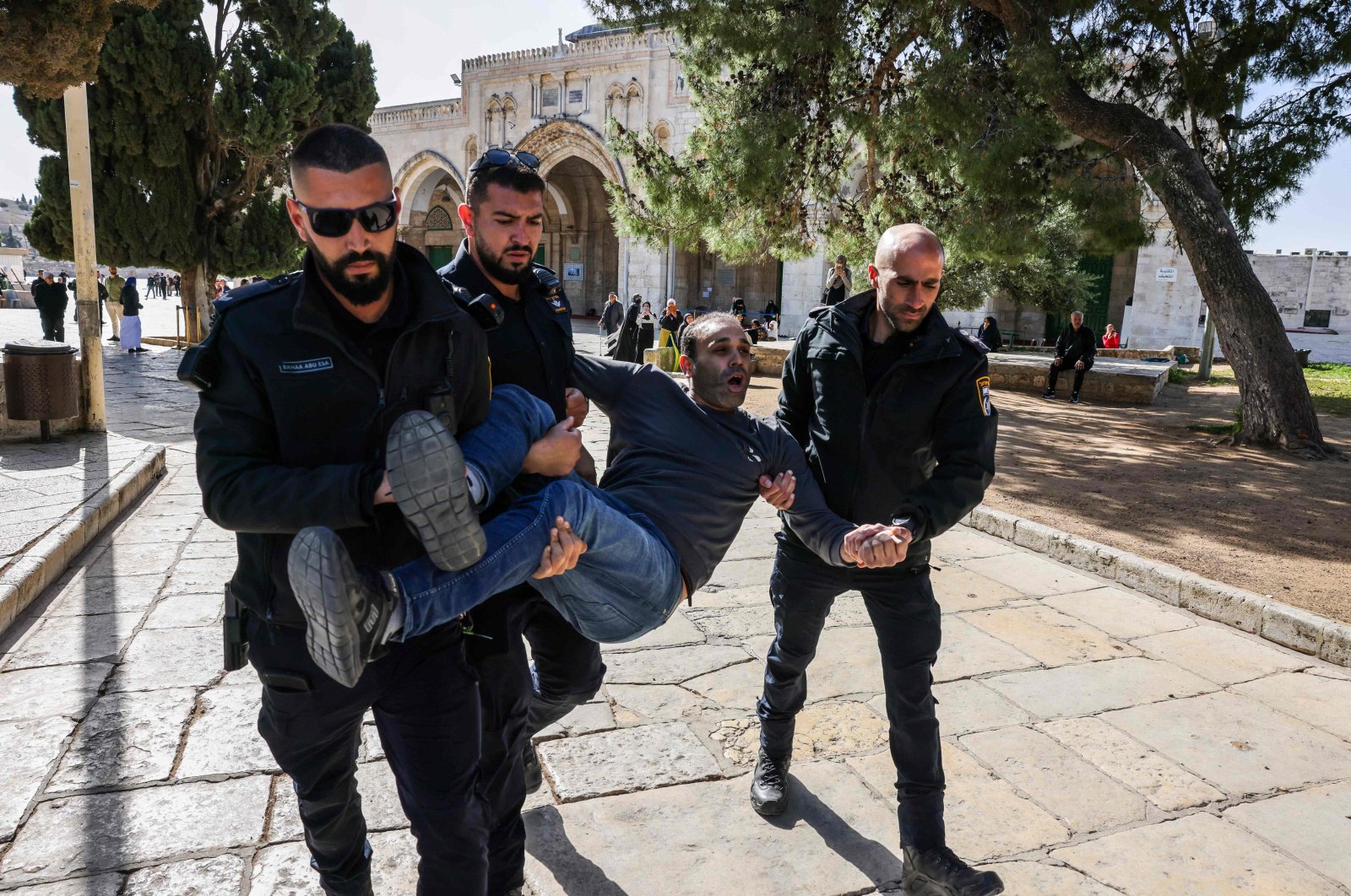 Israeli policemen detain a Palestinian man at the Al-Aqsa Mosque compound, East Jerusalem, Palestine, April 5, 2023. (AFP Photo)