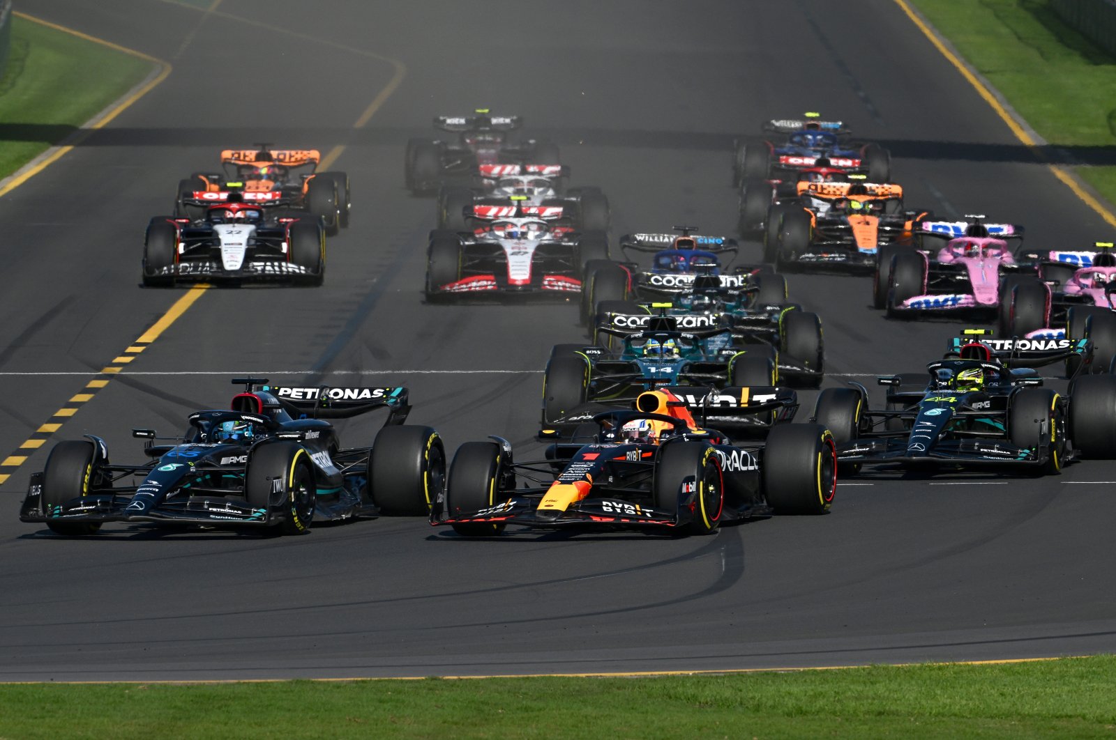 Mercedes driver George Russell of Great Britain (L) passes Red Bull driver Max Verstappen of Netherlands (2nd L) at the start of the 2023 Australian Grand Prix at the Albert Park Circuit, Melbourne, Australia, April 2, 2023. (EPA Photo)