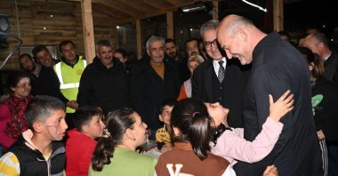 Interior Minister Süleyman Soylu meets children at iftar dinner, in Pazarcık district of Kahramanmaraş, Türkiye, April 6, 2023. (IHA Photo)