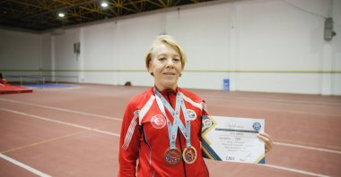 Turkish athlete Ayşe Babür shows her medals after training at Eskişehir Technical University (ESTU) Faculty of Sports Sciences athletics hall, Eskişehir, Türkiye, March 23, 2023. (AA Photo)