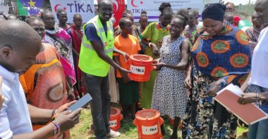 The volunteers of the Turkish Cooperation and Coordination Agency (TIKA) distribute coal briquettes to women in Juba, South Sudan, April 6, 2023. (Photo Courtesy of TIKA)