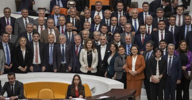 Lawmakers pose for a group photo with Türkiye's Deputy Parliament Speaker Haydar Akar after he held his final session in the capital Ankara, Türkiye, April 3, 2023. (AA Photo)
